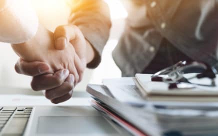 personal injury lawyer shaking hands with a client