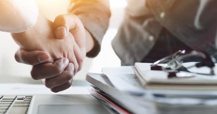 personal injury lawyer shaking hands with a client