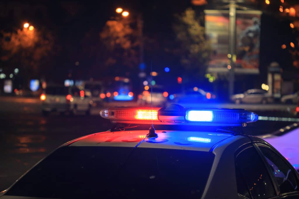 police car at night in city