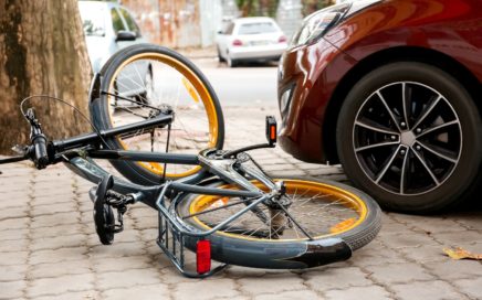 Accident between car and bicycle on city street