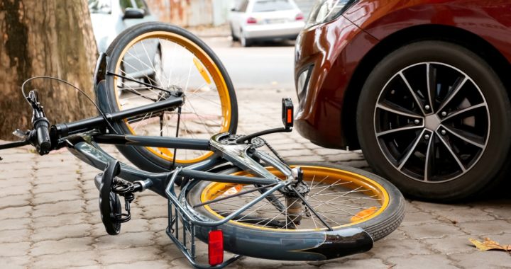 Accident between car and bicycle on city street